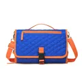 Cambiador de pañales portátil azul real con ribete naranja y correa ajustable - Azul