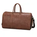Dark brown retro travel bag with embossed texture and adjustable shoulder strap - Tan
