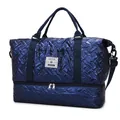 Dunkelblaue glänzende Reisetasche mit Steppmuster, Schuhfach und Crossbody-Gurt - Blau