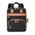 Black canvas diaper backpack with brown leather trim and multiple storage pockets - Black