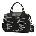 Black quilted large travel bag with wave embroidery and leather-reinforced handles - Black