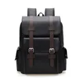 Vintage black leather backpack with brown straps and silver buckles on white background - Classic Black