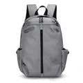 Minimalist grey water-resistant travel backpack with large capacity and matte finish - Gray