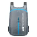 Foldable lightweight waterproof hiking backpack in dark grey with blue zipper accents - Gray