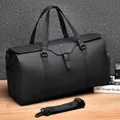 Black matte faux leather travel duffel bag with buckled flap and detachable strap - Black