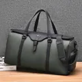 Large olive green waterproof travel duffel bag with black leather handles and shoulder strap - Green