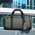 Sac de voyage vert olive en tissu imperméable avec poignées renforcées pour le fitness - Vert
