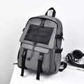 Urban grey laptop backpack with black utility straps and adjustable side buckles - Gray