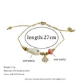 Detail of bohemian ocean fish ceramic bracelet with 18K gold plated seashell charm - White Fish Style (MSB0475)