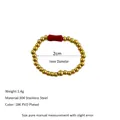 Macro shot of 18K PVD gold plated 304 stainless steel beaded ring with red tube stone - Red Tube Bead Accent Style (MSR0039)