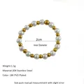 Detail of 2cm beaded ring with white pearls, 18K gold-plated beads, and 304 stainless steel - Gold White Alternating Pearl Style (MSR0040)
