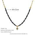 Detail view of 18K PVD gold plated 304 stainless steel necklace with blue beads and charm - Curved Pendant (MSNK0230)