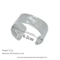 Detail of silver 304 stainless steel bangle with hammered texture and 6.2cm inner diameter - Hammered Style (MSB0137-S) / Silver