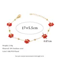 Detail showing 304 stainless steel bracelet size 17 plus 5.5cm with red flower beads - Red Flower Bracelet / Gold