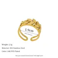 Macro detail of gold leaf pattern ring band with 304 stainless steel material label - Hollow Leaf Style (MSR0170)