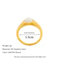 Close-up of gold stainless steel teardrop ring with white gemstone and size measurements - US 8 / Gold