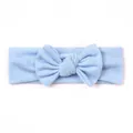Macro detail of the light blue elastic knitted cotton baby headband with a large bow - Light Blue