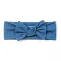 Detail view of teal knitted baby headband with a handmade bow and soft ribbed texture - Navy Blue