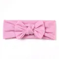 Detailed view of pink knitted baby headband featuring a soft cotton bow design - Pink