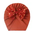 Infant ribbed turban hat in caramel with a red gold-dotted bow decoration - Wine Red