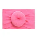 Soft nylon baby headband with a donut knot in vibrant hot pink ribbed fabric - Rose Red