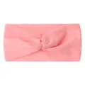 Detailed view of pink knotted baby headband made from soft elastic nylon fabric - Pink