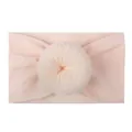Soft nylon baby headband in light pink with a cute doughnut style knotted detail - Flesh Pink
