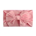 Zachte nylon baby hoofdband met een grote lichtroze strik op een witte achtergrond - Roze