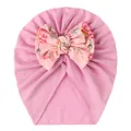 Detailed view of baby pink knot hat with large vintage floral pattern double bow - Pink