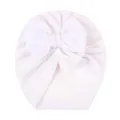 Detail of soft white velvet baby turban hat with large decorative bow for infants - White