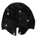 Detail of black velvet baby turban hat featuring a large bow and six white pearls - Black