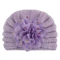 Detail of lavender baby knit hat with large sequined chiffon flower and gold dot accents - Purple