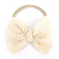 Bandeau bébé sans couture avec nœud crème en maille gaufrée sur élastique nude - Beige