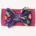 Halloween baby headband with large pumpkin print bow on stretchy magenta nylon band - Deep purple