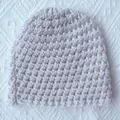 Off-white hand-knitted warm crochet baby winter hat with thick textured weave - Beige