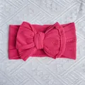 Elastic rose pink nylon knit baby headband featuring a large textured double bow knot - Burgundy