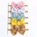 Vue détaillée du lot de 5 bandeaux bébé aux couleurs acidulées avec texture côtelée - Rose+Blanc+Bleu+Jaune+Café
