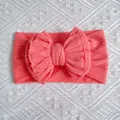Soft coral pink nylon baby headband with a large lace-edged double bow decoration - Watermelon red