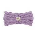 Detail of lavender knitted baby headband with a central pearl and rhinestone ornament - Purple