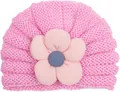 Close-up of pink knitted baby turban hat with handmade corduroy flower detail - Pink