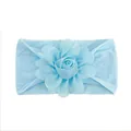 Detail of light blue baby nylon headband with handcrafted soft fabric flower ornament - Blue