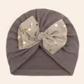 Detail of baby turban hat with double layer bow and gold polka dot print on soft grey fabric - Gray