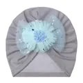 Detail of baby turban hat in grey fabric with a blue mesh flower and sequined stars - One Size / Gray