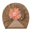 Close-up of baby mesh turban hat with pink fabric flower and gold star bow detail - One Size / Coffee
