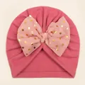 Warm pink knit baby beanie with a decorative gold polka dot bow and velvet lining - Dark Mauve