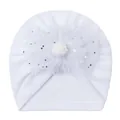 Detail of white infant turban hat with mesh flower, sequins, and plush pompom - One Size / White