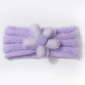 Detailed close-up of a soft purple knitted baby headband with a large 3D floral decoration - Taro Purple