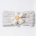 Close-up of cream knit baby headband with large white daisy flower and mesh detail - Beige