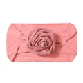 Close-up of soft pink nylon baby headband with a glittery star patterned rose floral detail - Dark Mauve