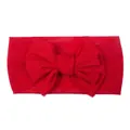 Detail of red baby headband featuring a soft mesh bow on a stretchy nylon fabric band - Red